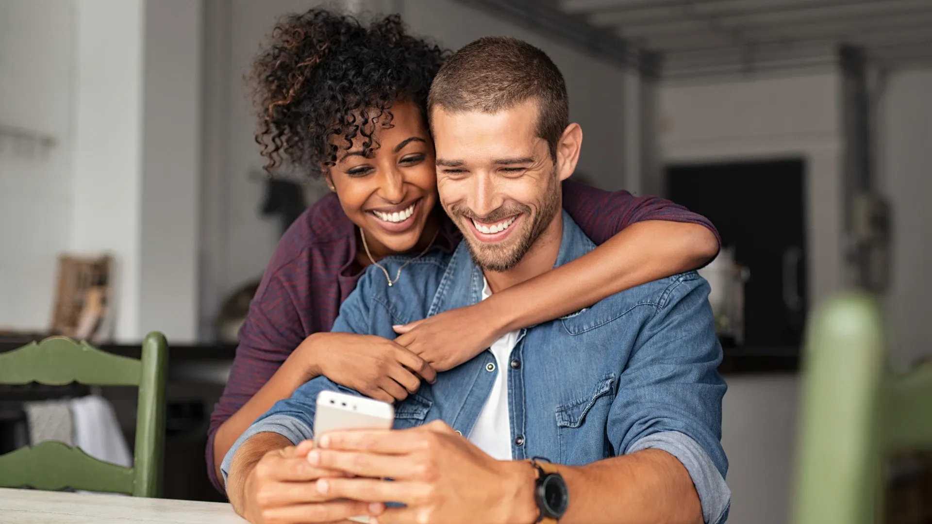 Engaged couple excitedly view a virtual tour of a wedding venue